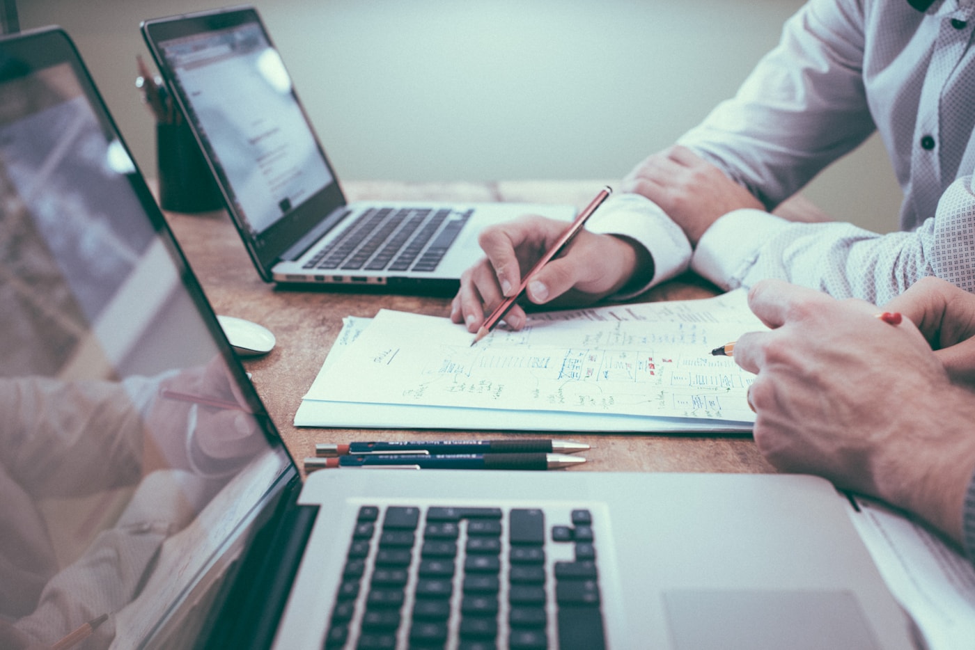 Professional reviewing business analysis documents